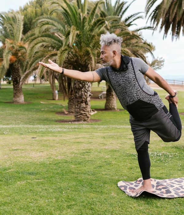 Person balancing gracefully on one leg in a frost inspired environment